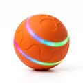 BorkBall Disco orange interactive dog ball with glowing rainbow LED stripes and paw print emboss on white background