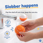 Hands rinsing the washable silicone shell of the BorkBall Disco dog ball while the core stays dry